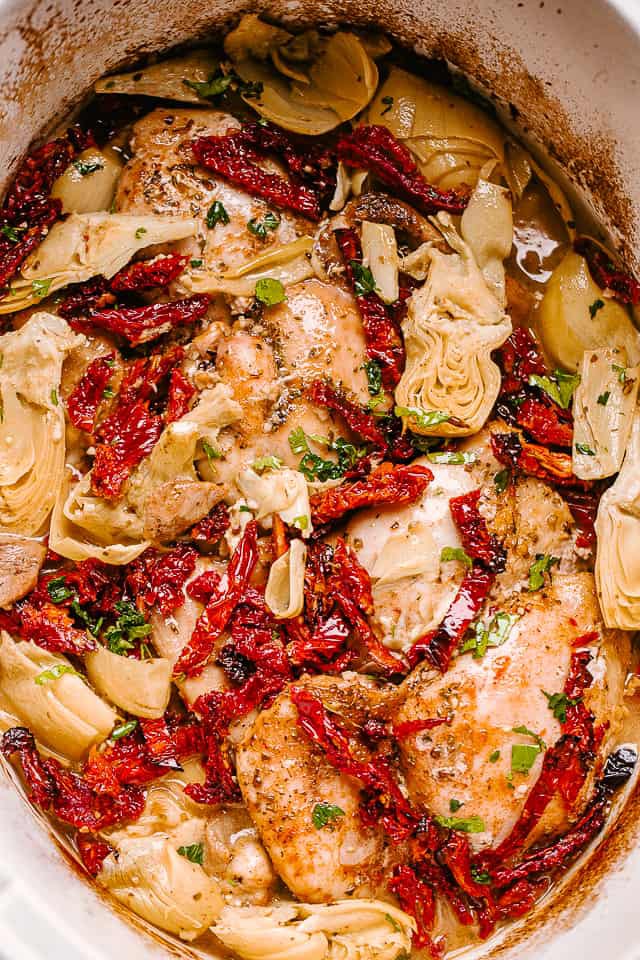 Crock Pot Chicken Thighs Recipe with Artichokes and Sun-Dried Tomatoes | mhandy | Copy Me That